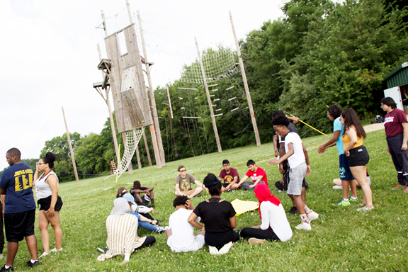 College Access Program students bonding and playing activities on a field.