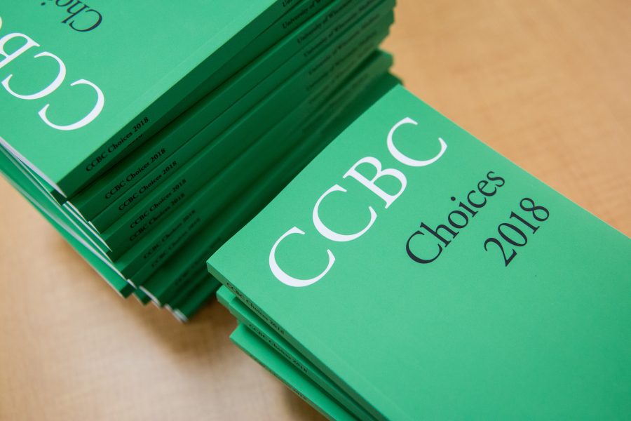 Green books in two piles, one vertical and other horizontal, reads: "CCBC Choices 2018".