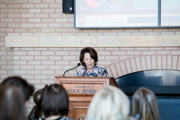 Diana Hess speaking at podium in School of Education.