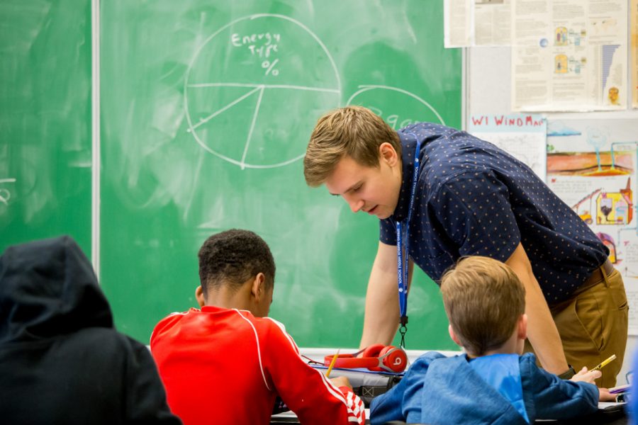 Student teacher working with students at a middle school