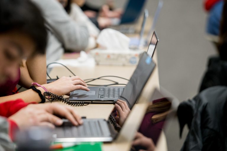 Students work on computers in their elementary ed class.